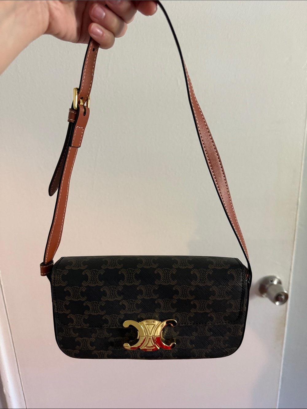 Crescent-Emblem Brown Crossbody Bag with Adjustable Strap